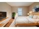 Comfortable bedroom featuring a light-colored bed, a plant, and a TV at 2693 Larkspur Se Dr, Atlanta, GA 30316