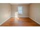 Bedroom with hardwood floors, neutral paint, and natural light from the window at 2693 Larkspur Se Dr, Atlanta, GA 30316