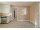 Eat-in kitchen with tiled floor, stainless steel dishwasher and granite countertops at 2693 Larkspur Se Dr, Atlanta, GA 30316