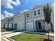 Charming townhomes feature attached garages, well-manicured lawns, and attractive color schemes at 307 Winton Way, Villa Rica, GA 30180