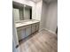 Bright bathroom with granite double vanity and hard surface flooring at 45 Emerald Ln, Covington, GA 30014