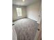 Bedroom with neutral carpeting, one window, and light gray walls at 45 Emerald Ln, Covington, GA 30014