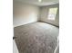 Bedroom featuring neutral carpet and a window for natural light at 45 Emerald Ln, Covington, GA 30014