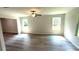 Bright living room featuring laminate floors and natural light from the windows at 45 Emerald Ln, Covington, GA 30014