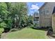 Lush backyard with upper and lower decks and brick elevation at 5357 Harbury Cv, Suwanee, GA 30024