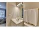 Bright bathroom featuring a modern vanity and a white sink basin at 5357 Harbury Cv, Suwanee, GA 30024