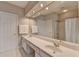 Modern bathroom featuring double sinks, recessed lighting, and a combined tub and shower at 5357 Harbury Cv, Suwanee, GA 30024