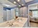 Well-lit bathroom with double sinks, creating a functional and stylish space for daily routines at 5357 Harbury Cv, Suwanee, GA 30024