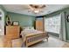 Charming bedroom with natural light, creating a relaxing and inviting space for rest and rejuvenation at 5357 Harbury Cv, Suwanee, GA 30024