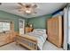 Inviting bedroom with ample natural light and wood furniture, creating a peaceful and serene environment at 5357 Harbury Cv, Suwanee, GA 30024