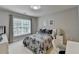 Comfortable bedroom with natural light, offering a serene space for relaxation and restful nights at 5357 Harbury Cv, Suwanee, GA 30024