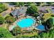 Aerial view of the community pool, waterslide, and surrounding recreational areas at 5357 Harbury Cv, Suwanee, GA 30024