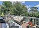 Deck area with outdoor seating overlooking a lush green landscape at 5357 Harbury Cv, Suwanee, GA 30024