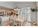 Open-concept kitchen and dining area filled with natural light and modern amenities at 5357 Harbury Cv, Suwanee, GA 30024