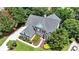 Beautiful exterior view of a brick house with a well-manicured lawn and lovely landscaping at 5357 Harbury Cv, Suwanee, GA 30024
