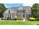 Beautiful brick home with manicured landscaping and a welcoming entrance at 5357 Harbury Cv, Suwanee, GA 30024