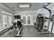 Well-equipped fitness room with modern exercise equipment and ample space for a full body workout at 5357 Harbury Cv, Suwanee, GA 30024