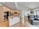 Open kitchen featuring a breakfast bar, stainless appliances, and seamless flow to the living space at 5357 Harbury Cv, Suwanee, GA 30024