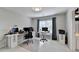 Spacious office with natural light, modern decor, and ample workspace, perfect for productivity and comfort at 5357 Harbury Cv, Suwanee, GA 30024