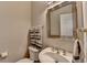 Stylish powder room with vessel sink, decorative fixtures, and fresh towels at 5357 Harbury Cv, Suwanee, GA 30024