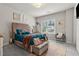 Bedroom with a luxurious bed, window, and plush carpeting at 10 Nesbit Reserve Ct, Atlanta, GA 30350