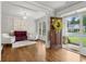 Bright foyer with hardwood floors, elegant seating, and a view to the outside at 10 Nesbit Reserve Ct, Atlanta, GA 30350