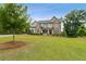 Charming two-story home with a well-maintained lawn and stone-accented facade at 10 Nesbit Reserve Ct, Atlanta, GA 30350