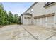 Spacious three-car garage with ample parking space and a well-maintained driveway at 10 Nesbit Reserve Ct, Atlanta, GA 30350
