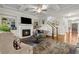 Spacious living room with fireplace, staircase, and coffered ceilings at 10 Nesbit Reserve Ct, Atlanta, GA 30350