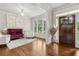 Elegant living room featuring hardwood floors, stylish seating, and a bright, airy atmosphere at 10 Nesbit Reserve Ct, Atlanta, GA 30350