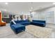 Large living room showcasing a custom bar, a comfortable seating area, and lots of natural light at 10 Nesbit Reserve Ct, Atlanta, GA 30350