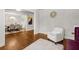 Living room with hardwood floors, stylish seating, and view to dining area at 10 Nesbit Reserve Ct, Atlanta, GA 30350