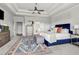 Spacious bedroom featuring a large bed, an ensuite bathroom, and tasteful furnishings at 10 Nesbit Reserve Ct, Atlanta, GA 30350