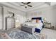 Inviting bedroom with a dresser, ensuite bathroom, and a plush upholstered bed frame at 10 Nesbit Reserve Ct, Atlanta, GA 30350