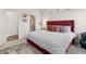 Cozy main bedroom with an adjoining bathroom, soft carpet, and a plush red bed at 10 Nesbit Reserve Ct, Atlanta, GA 30350
