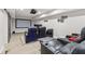 Home theater room with plush seating, projector, and large screen for an immersive viewing experience at 10 Nesbit Reserve Ct, Atlanta, GA 30350
