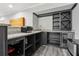 Basement wet bar with granite counters, wine cooler, shelving, and microwave at 10 Nesbit Reserve Ct, Atlanta, GA 30350