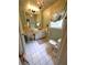 This charming bathroom features white tiled floors, a vanity with great storage, and decorative accents at 1242 Star Ne Dr, Brookhaven, GA 30319