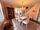 Elegant dining room with a glass table, chandelier and decorative animal print rug at 1242 Star Ne Dr, Brookhaven, GA 30319