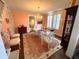 Elegant dining room with glass table, chandelier, and decorative animal print area rug at 1242 Star Ne Dr, Brookhaven, GA 30319