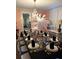 Elegant dining room with fancy chandelier and a beautifully set table at 1242 Star Ne Dr, Brookhaven, GA 30319