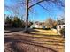 Classic two-story home with grand columns surrounded by a spacious front yard at 1242 Star Ne Dr, Brookhaven, GA 30319