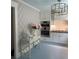 Bright kitchen featuring white cabinets, stainless steel appliances, modern lighting and eat-in area at 1242 Star Ne Dr, Brookhaven, GA 30319