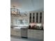 Bright kitchen featuring white cabinets, stainless steel appliances, farmhouse sink and modern lighting at 1242 Star Ne Dr, Brookhaven, GA 30319