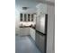 Bright kitchen featuring white cabinets, stainless steel appliances, and modern lighting at 1242 Star Ne Dr, Brookhaven, GA 30319