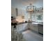 Charming kitchen features white cabinets, stainless steel appliances, farmhouse sink and modern lighting at 1242 Star Ne Dr, Brookhaven, GA 30319