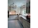 Bright kitchen featuring white cabinets, stainless steel appliances, farmhouse sink and modern lighting at 1242 Star Ne Dr, Brookhaven, GA 30319