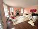 Bright living room featuring a fireplace, hard wood floors, and comfortable seating at 1242 Star Ne Dr, Brookhaven, GA 30319