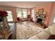 Inviting living room featuring a fireplace, hardwood floors, and glass coffee table at 1242 Star Ne Dr, Brookhaven, GA 30319
