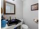 Simple bathroom with a black sink and commode with white walls at 248 Springbottom Dr, Lawrenceville, GA 30046